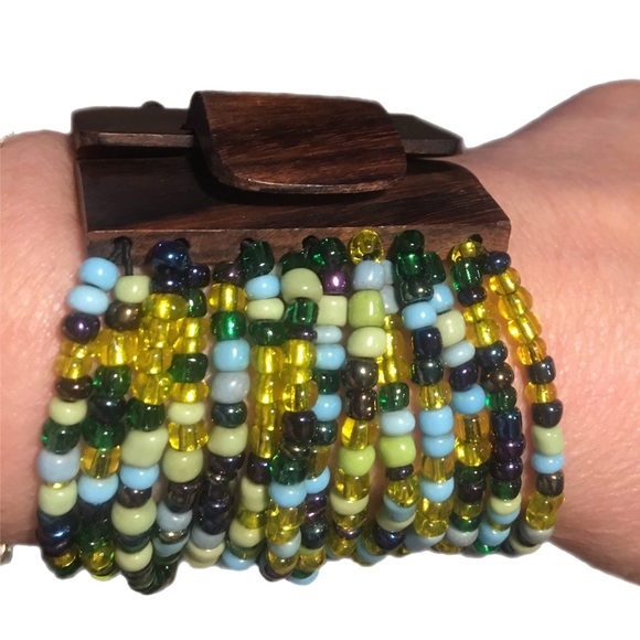 Jewelry - Wide bracelet of 14 strands of colourful beads with a wooden look clasp